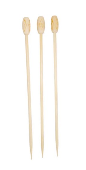 A bamboo pick with a tiki ball at the top, adding a fun and tropical touch to appetizers or cocktails.