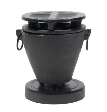 A black hibachi stove with a compact design, perfect for grilling and outdoor cooking over an open flame.