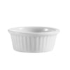 0.5oz fluted white ramekin made from durable porcelain, perfect for sauces, condiments, amuse-bouches; oven, microwave, and dishwasher safe for elegant, small-portion presentation.