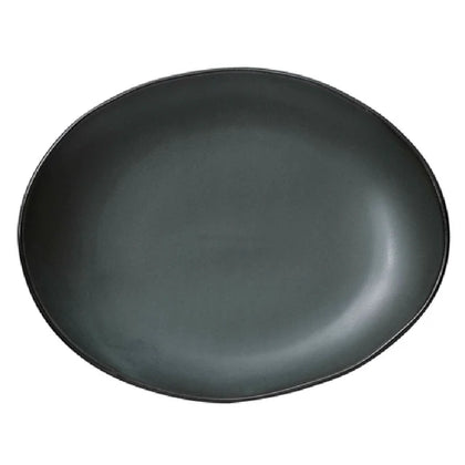 This oval plate offers ample space for presentation of various food items in restaurant, cafeteria, or catering settings. Its microwave and dishwasher-safe properties simplify reheating and cleaning processes, making it suitable for repetitive daily use in diverse foodservice operations. The dark green finish enhances presentation and resilience in demanding kitchen workflows.