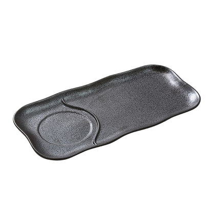 This rectangular porcelain plate is designed to match the DB-4105 skillet, providing a cohesive and stylish table setting. Crafted of durable black porcelain, it is safe for use in dishwashers, ovens, and microwaves, offering both elegance and practicality for any dining occasion. Elevate your dining experience with the high quality and affordable restaurant dinnerware.