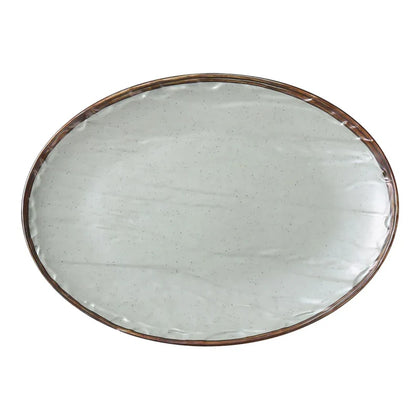 This oval plate features a sleek matte green finish that adds a touch of elegance to appetizers and desserts, perfect for upscale dining in hotels and restaurants. Offers a versatile oval shape, making it ideal for presenting a variety of dishes, from appetizers to desserts, in cafes and dining establishments allowing you to elevate your dining experience with these high quality affordable restaurant dinnerware.
