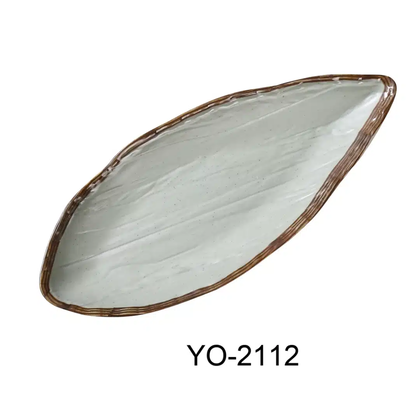 Elevate your dining experience with the EcoQuality Oval Display Plate crafted from durable melamine. Its matte green tea finish, accented by warm brown edges, offers a stylish alternative perfect for Asian-inspired table settings. Designed with a sturdy foot, this plate is ideal for both restaurant and home use, combining elegance with practicality for everyday meals or special occasions. 