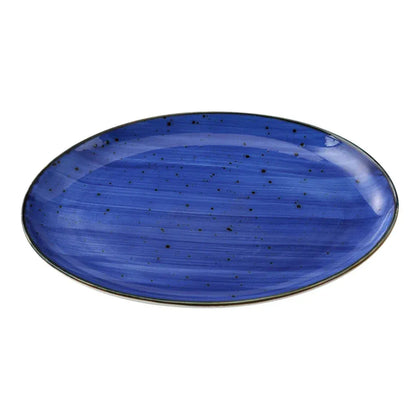 This oval coupe platter features a curved edge for secure food presentation. Its glazed porcelain material ensures dishwasher, oven, and microwave safety, making it ideal for restaurants, catering services, and institutional kitchens. The plate's robust design supports high-volume handling, while its smooth surface facilitates easy cleaning and maintenance, supporting efficient service workflows in busy settings. High quality affordable restaurant dinnerware.