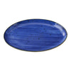 This oval coupe platter features a curved edge for secure food presentation. Its glazed porcelain material ensures dishwasher, oven, and microwave safety, making it ideal for restaurants, catering services, and institutional kitchens. The plate's robust design supports high-volume handling, while its smooth surface facilitates easy cleaning and maintenance, supporting efficient service workflows in busy settings. High quality affordable restaurant dinnerware.