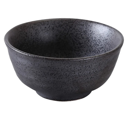 This rice bowl is made of porcelain and features a matte black finish with a dark reactive glaze for a modern presentation. Ideal for rice, sauces, or appetizers in stylish tabletop settings such as restaurants, cafes, and home dining. High quality and affordable restaurant dinnerware.