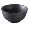 This rice bowl is made of porcelain and features a matte black finish with a dark reactive glaze for a modern presentation. Ideal for rice, sauces, or appetizers in stylish tabletop settings such as restaurants, cafes, and home dining. High quality and affordable restaurant dinnerware.