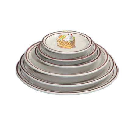 This ceramic plate offers a balance of durability and practicality for foodservice setups, supporting steady daily use in commercial kitchens. Its ceramic construction ensures heat resistance, while the 6.50 inches in diameter is optimized for standard serving portions. The plate’s dishwasher, microwave, and oven-safe features facilitate efficient workflow and quick turnaround times in busy foodservice settings. High quality and affordable restaurant dinnerware.