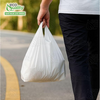 Small white plastic shopping bags with handles for groceries and retail