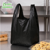 Large black plastic shopping bags with handles for retail and grocery use