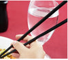 A pack of 10 black plastic chopsticks, stylish and durable.
