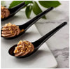 Set of 12 black melamine soup spoons, durable, heat-resistant, and perfect for casual and formal dining.