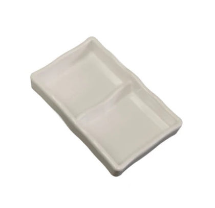 A set of ivory melamine dishes with two compartments, perfect for separating food while offering a sleek, durable design.