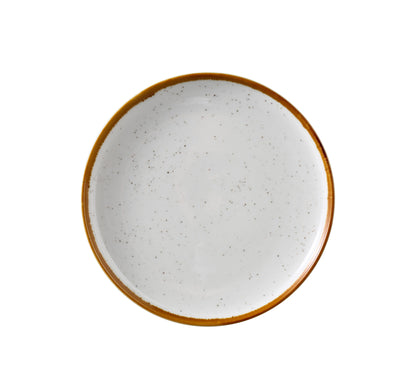 Yanco Round Plate With Up-Right Rim GL-106 brings a modern elegance to tabletop presentations. Crafted from durable porcelain, it showcases a clean white finish with soft speckles and a gently colored rim. The up-right edge design not only adds a distinctive touch but also helps contain food, making it ideal for serving bread, butter, or small appetizers with style.