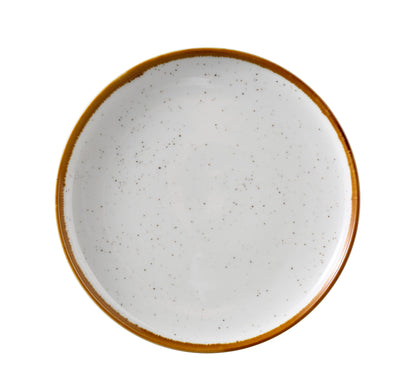 Yanco Round Plate With Up-Right Rim GL-107 brings a modern elegance to tabletop presentations. Crafted from durable porcelain, it showcases a clean white finish with soft speckles and a gently colored rim. The up-right edge design not only adds a distinctive touch but also helps contain food, making it ideal for serving bread, butter, or small appetizers with style.