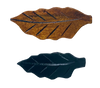 Black leaf-shaped chopstick rest, perfect for keeping chopsticks neatly placed.