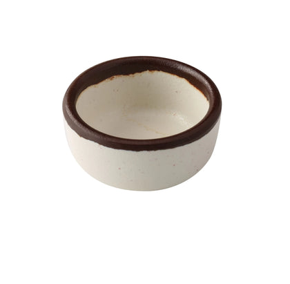 Yanco Sauce Dish NA-5002 Made from high-quality melamine, this server is both durable and lightweight. Its round shape and break-resistant nature make it suitable for frequent use in commercial dining environments. This server is designed to be dishwasher safe, ensuring convenient and efficient cleaning, essential for high-turnover settings. The ivory color with a speckled finish and brown rim adds a sophisticated touch to the presentation of sauces and condiments. 