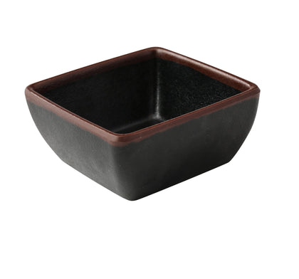 Yanco Square Sauce Dish NA-5004BK Made from high-quality melamine, this server is durable and lightweight. Its square shape and break-resistant nature make it ideal for frequent use in commercial dining settings. This server is designed to be dishwasher safe, ensuring easy and efficient cleaning, which is essential for high-turnover environments. The black color with a speckled finish and brown rim adds a touch of elegance to the presentation of sauces and condiments. 