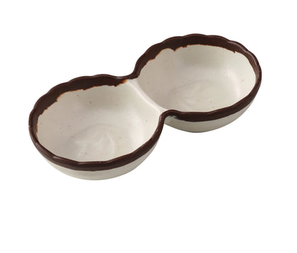 Yanco Two-Divided Sauce Dish NA-506 Made from durable melamine, it is designed for break resistance and easy handling. This server features two compartments, each with a capacity of 2 ounces, suitable for serving various condiments or sauces. The design includes an ivory color with a speckled brown rim, adding an attractive touch to the table. It is dishwasher safe, which ensures convenient and thorough cleaning, though it is not microwave safe. 