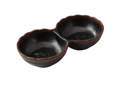 Yanco Two-Divided Sauce Dish NA-506BK Made from durable melamine, it is designed for break resistance and easy handling. This server features two compartments, each with a capacity of 2 ounces, suitable for serving various condiments or sauces. The design includes an black color with a speckled brown rim, adding an attractive touch to the table. It is dishwasher safe, which ensures convenient and thorough cleaning, though it is not microwave safe. 