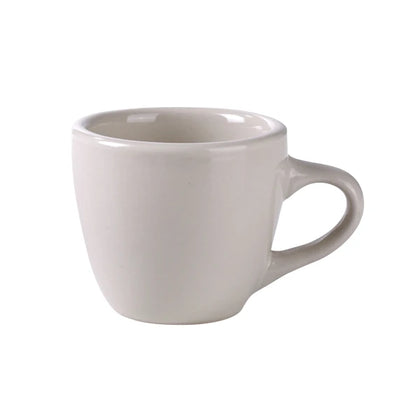 Yanco Espresso Cup RE-35 is a stylish and durable addition to your tableware collection. With a 3.5-ounce capacity, it is perfect for serving espresso, macchiato, and other small hot beverages. Crafted from sturdy porcelain, this cup withstands daily use while maintaining its elegant American white finish. The rounded handle ensures a comfortable grip, making it ideal for cafés, restaurants, and fine dining establishments.