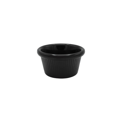 Fluted black ramekin with 1.5oz capacity and 2-1/2 inch diameter, ideal for sauces and dips; elegant, durable design great for restaurants, caterers, or stylish home presentations.
