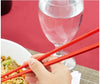 A pack of 10 red plastic chopsticks, bright and durable for everyday use.
