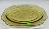 Square amber platter, perfect for serving appetizers or entrees with a stylish, modern design.