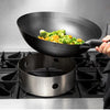 Set of 12 stainless steel wok rings, perfect for keeping woks steady and evenly heated during cooking.


