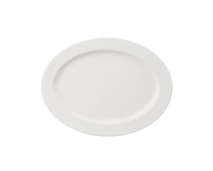 Yanco Platter VS-210 is an elegant serving solution for appetizers, shared dishes, and small entrees. Made from fully glazed porcelain with a durable magnesia body, this bone white platter combines a refined appearance with reliable strength, perfect for upscale restaurants, hotels, and banquet presentations.
