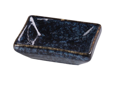 This Sauce Dish is a stylish and practical addition to any table setting. Crafted from high-quality porcelain with a sleek glaze finish, this rectangular dish features a striking blue star pattern that enhances food presentation. Measuring 3