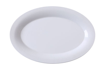 Yanco Platter SI-214 is an elegant and practical addition to any dining setup. Crafted from high-quality porcelain with a smooth white glaze, this 14-inch round platter is perfect for serving appetizers, fresh greens, cold cuts, and side dishes. Its timeless design blends effortlessly with various table settings, making it ideal for fine-dining restaurants, catered events, and hospitality venues. 